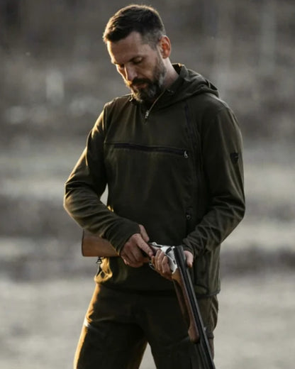 Dark Green coloured Northern Hunting Mens Hagni Shell Jacket on forest background 