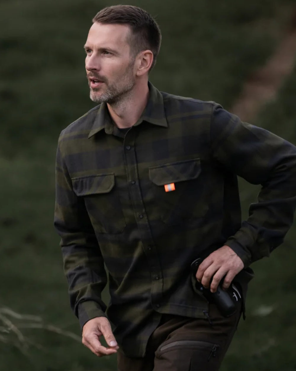 Dark Green coloured Northern Hunting Mens Kaare Cotton Stretch Shirt on forest background 