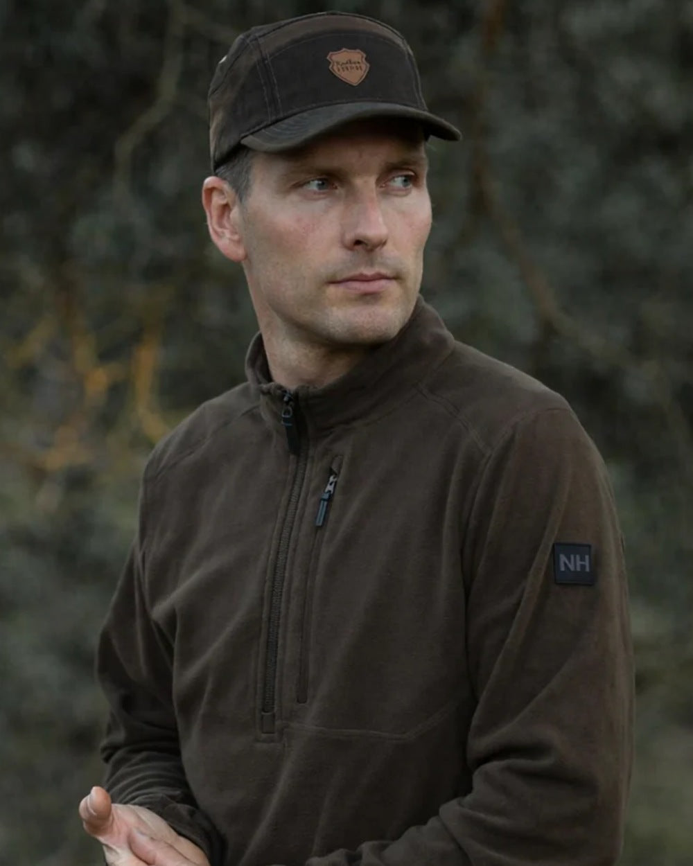 Green coloured Northern Hunting Mens Kettil 1000 Lightweight Fleece on forest background 
