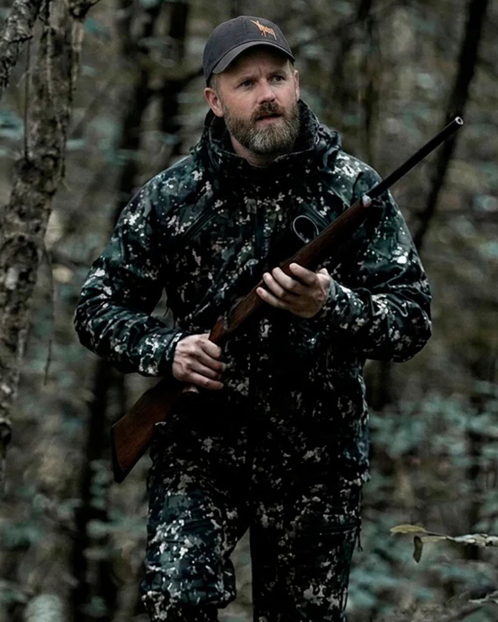 Camo coloured Northern Hunting Mens Skjold Ask Lightweight Hunting Jacket on forest background 