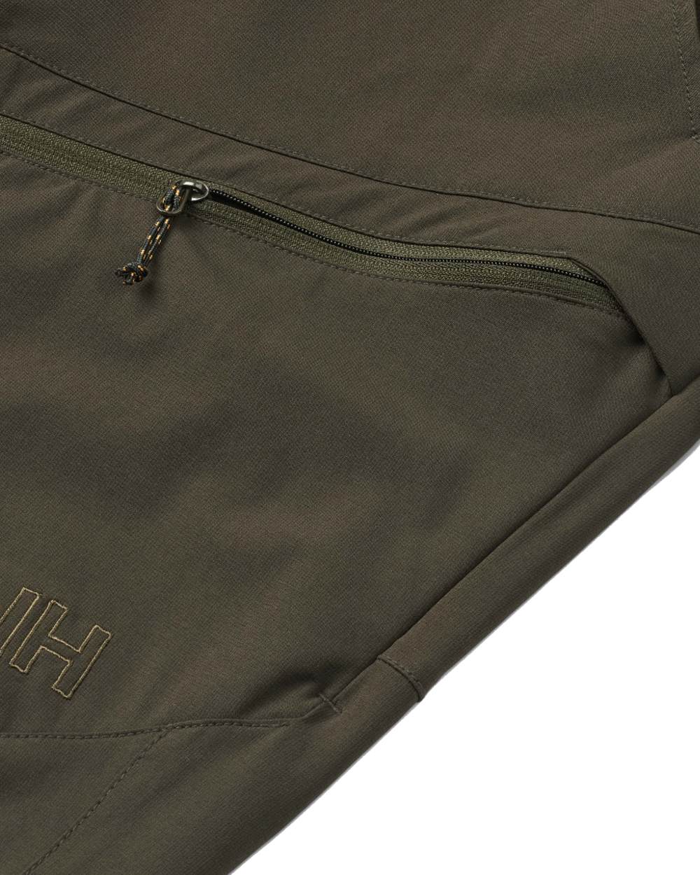 Dark Green coloured Northern Hunting Mens Toke Light Tanatex Outdoor Trousers on white background 