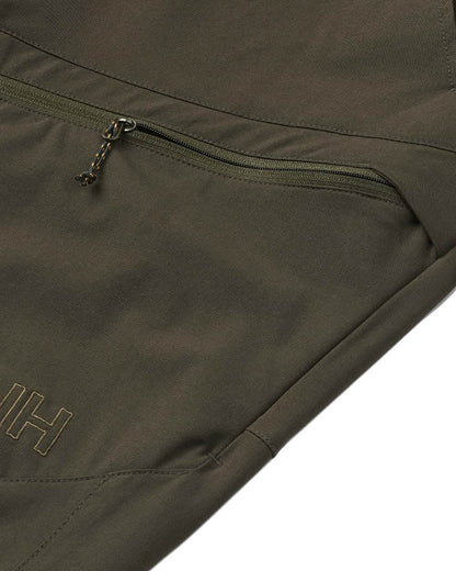 Dark Green coloured Northern Hunting Mens Toke Light Tanatex Outdoor Trousers on white background 