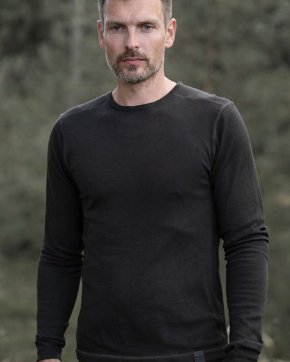 Dark Green coloured Northern Hunting Norr Vik Long Sleeve Baselayer Top on forest background 