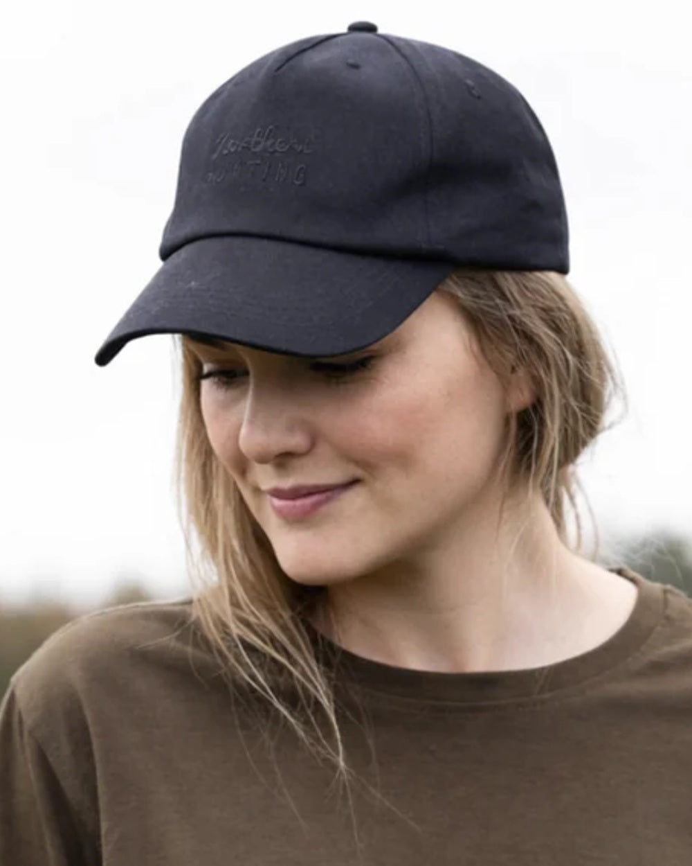 Black coloured Northern Hunting Ravn Water Repellent Cap on blurry background 