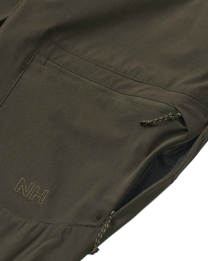Dark Green coloured Northern Hunting Womens Eydis Light Tanatex Outdoor Trousers on white background 