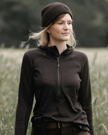 Dark Green coloured Northern Hunting Womens Hilda Half Zip Sweatshirt on forest background 