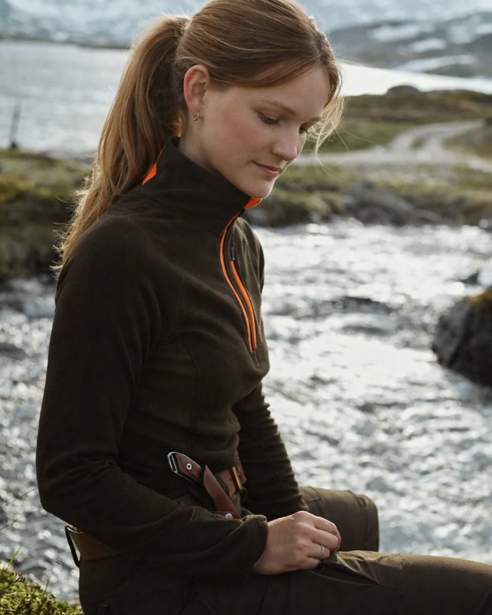 Brown coloured Northern Hunting Womens Revna Baselayer Top on lake background 