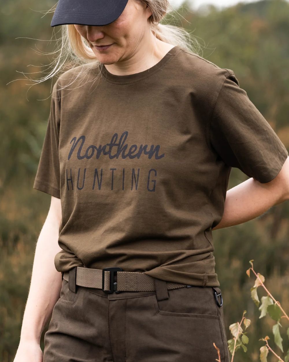 Green coloured Northern Hunting Womens Ronja Cotton T-Shirt on forest background 