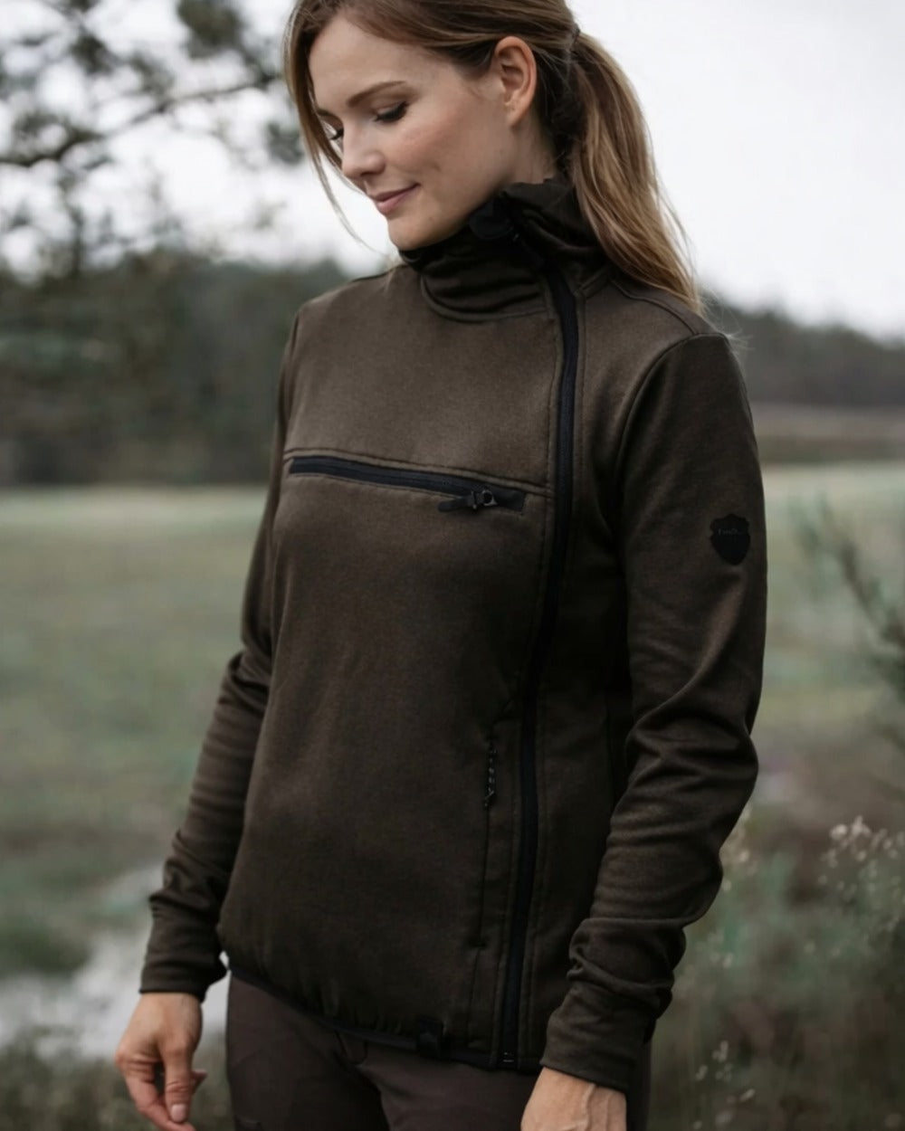 Brown coloured Northern Hunting Womens Saga Insulated Sweatshirt on forest background 