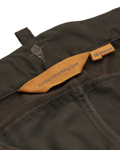 Dark Green coloured Northern Hunting Womens Tyra Pro Outdoor Trousers on white background 