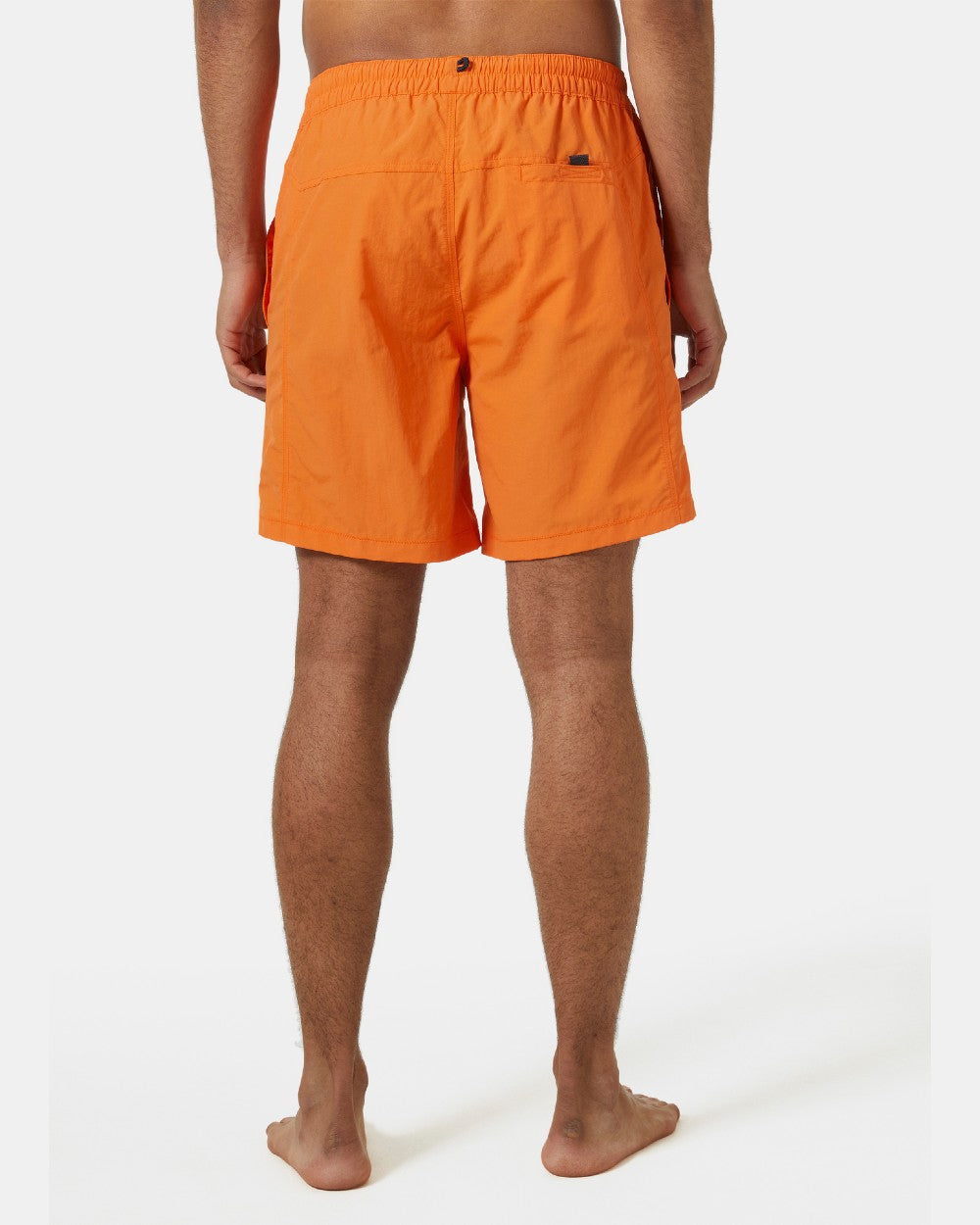 Poppy Orange coloured Helly Hansen Mens Calshot Trunks on a grey background 