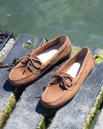 Sand Coloured Orca Bay Augusta Mens Deck Shoes On A Sea Background 