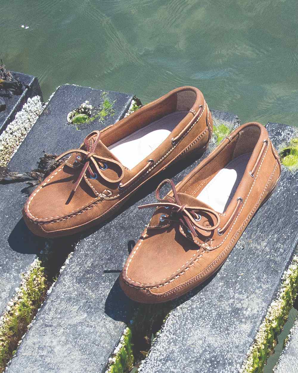 Sand Coloured Orca Bay Bahamas Womens Deck Shoes On A Lake Background 
