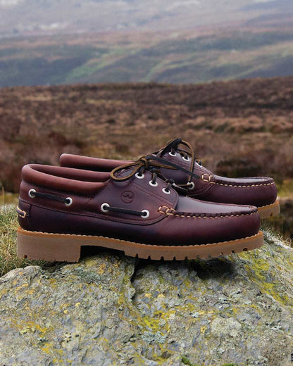 Burgundy Coloured Orca Bay Buffalo Mens Country Shoes On A Outdoor Background 