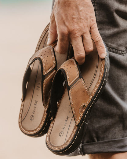 Sand coloured Orca Bay Mens Belize Sandals on sand background 