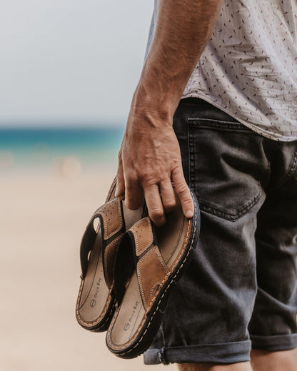 Sand coloured Orca Bay Mens Belize Sandals on sea background 
