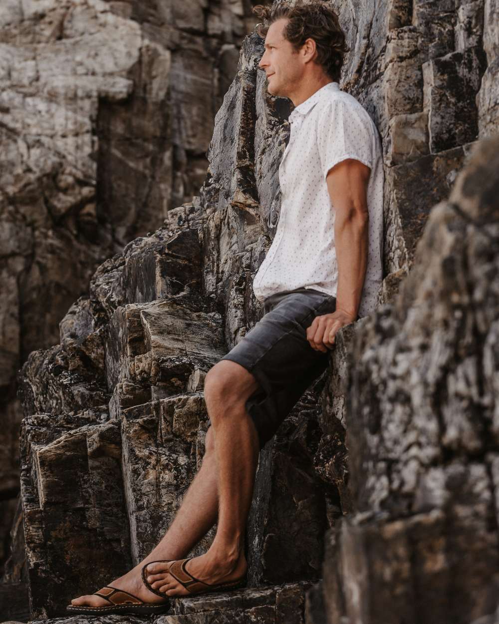 Sand coloured Orca Bay Mens Belize Sandals on rock background 