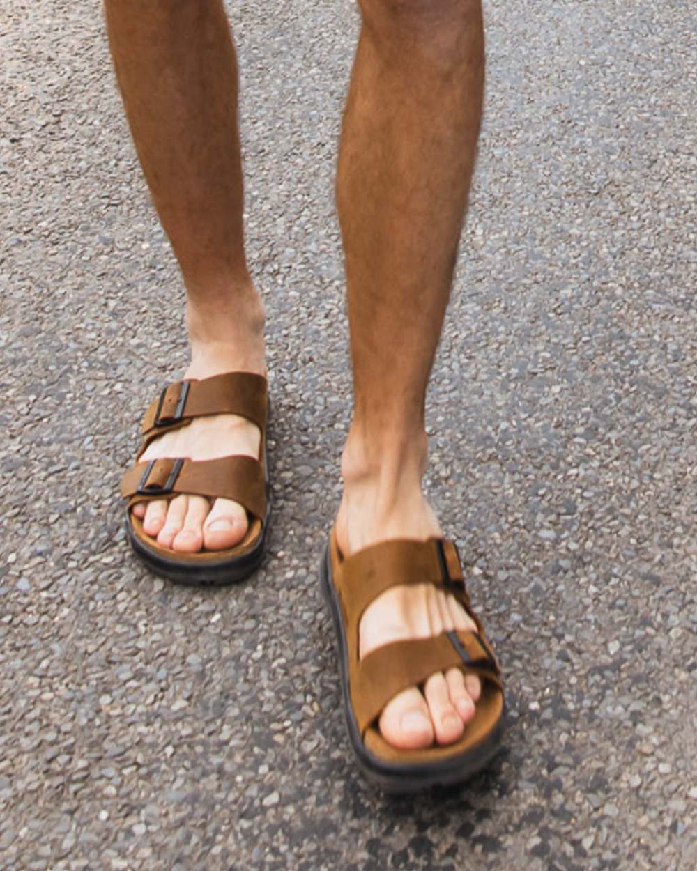 Sand coloured Orca Bay Mens Carbis Sandals on outdoor background 