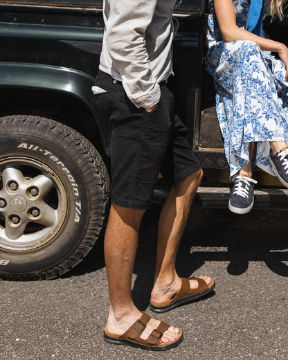 Sand coloured Orca Bay Mens Carbis Sandals on car background 