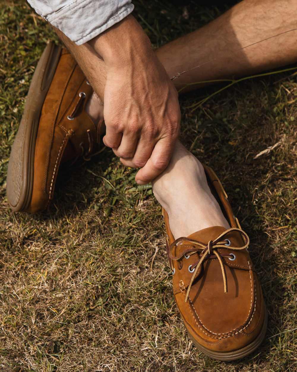 Sand Coloured Orca Bay Mens Fowey Wide Fit Deck Shoes on grassy background 