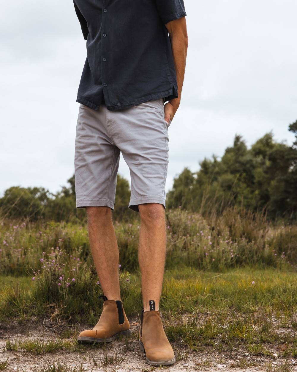 Sand coloured Orca Bay Mens Henley Shoes on grassy background 