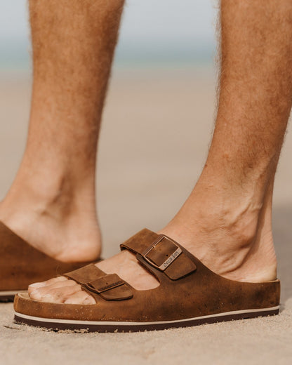 Dark Brown coloured Orca Bay Mens Saba Sandals on outdoor background 