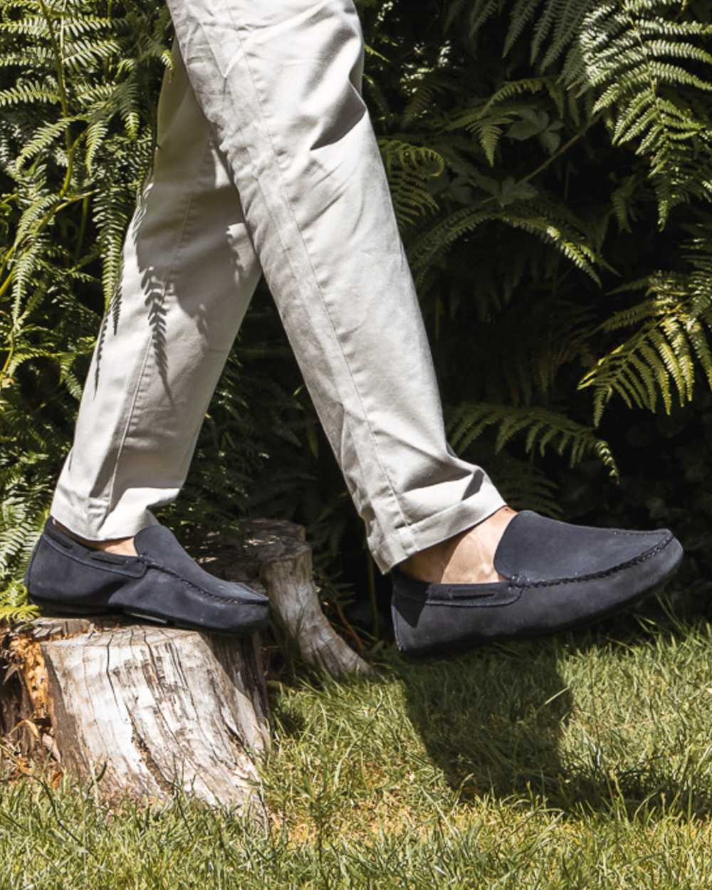Navy Coloured Orca Bay Mens Silverstone Loafers on grassy background 