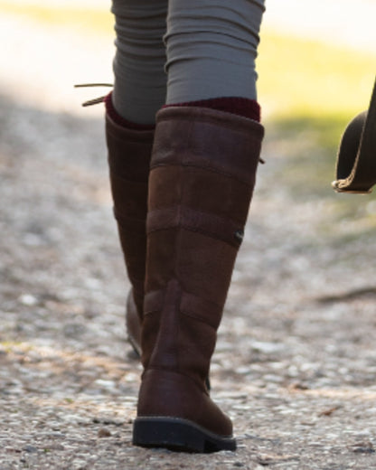 Brown coloured Orca Bay Orkney S-Fit Country Boots on outdoor background 