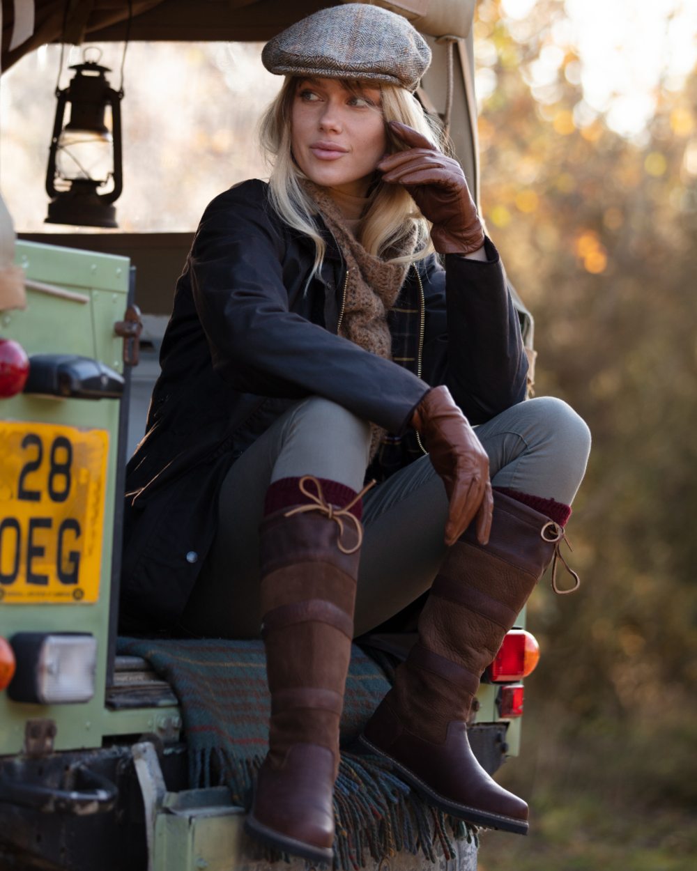Brown coloured Orca Bay Orkney S-Fit Country Boots on forest background 
