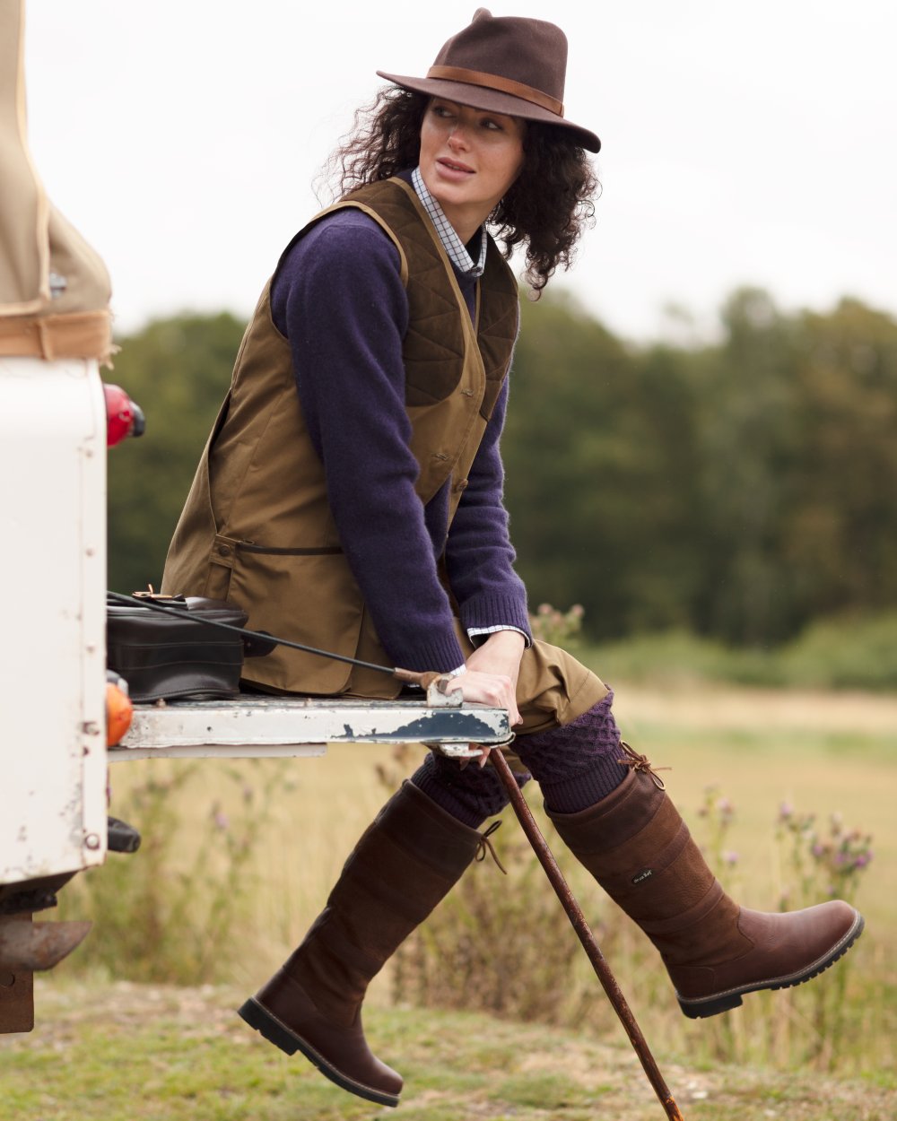 Brown coloured Orca Bay Orkney S-Fit Country Boots on forest background 