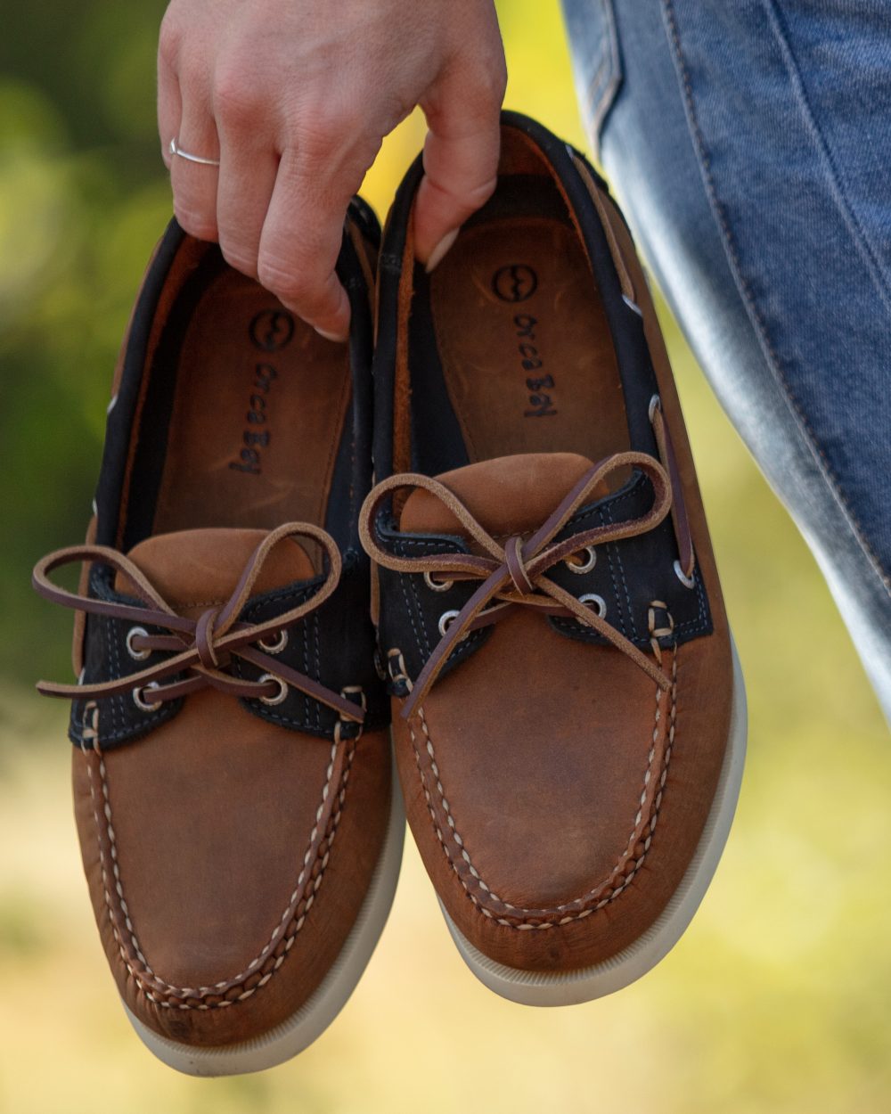 Sand Navy Coloured Orca Bay Womens Clovelly Deck Shoes on outdoor background 