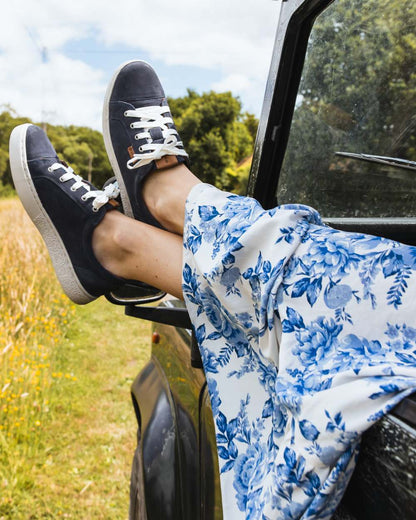 Indigo coloured Orca Bay Womens Mayfair Trainers on grassy background 