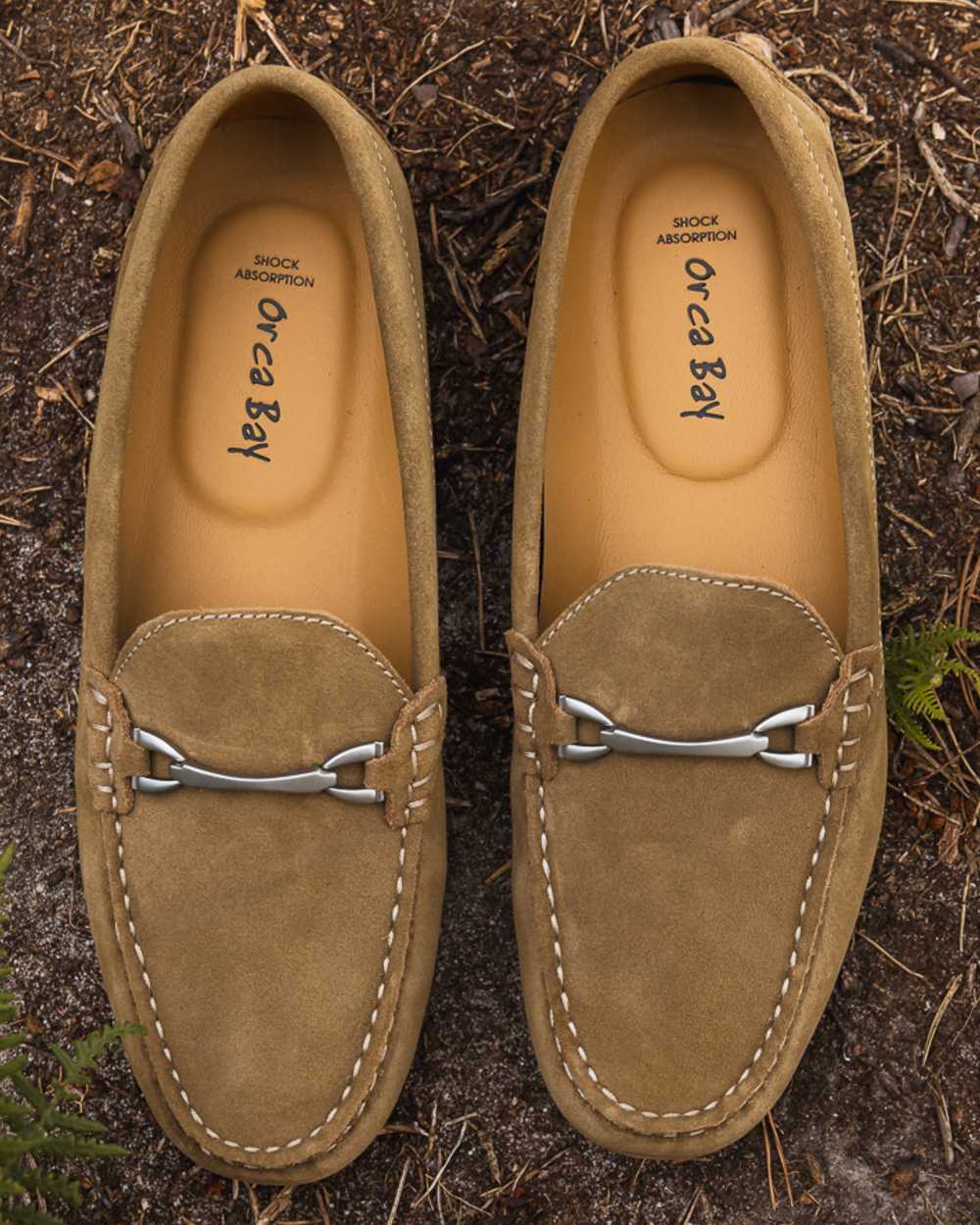 Taupe coloured Orca Bay Womens Sorrento Loafers on grassy background 