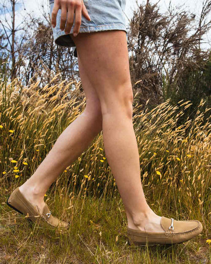Taupe coloured Orca Bay Womens Sorrento Loafers on grassy background 