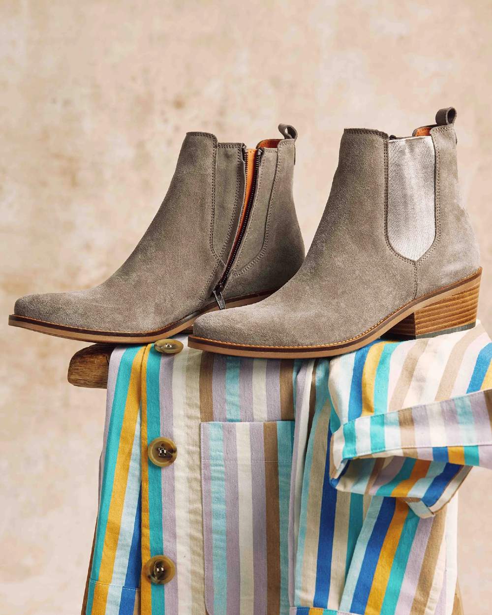 Camel coloured Penelope Chilvers Womens Rove Suede Boots on wall background 