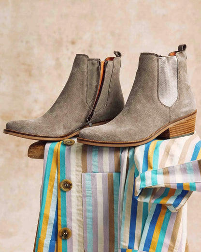 Camel coloured Penelope Chilvers Womens Rove Suede Boots on wall background 