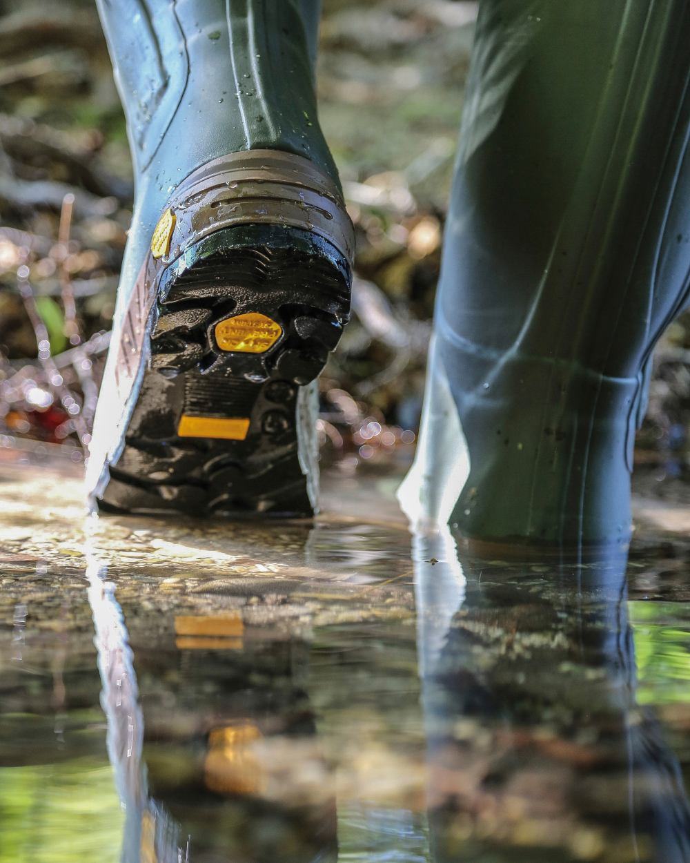 Green coloured Percussion Chantilly Full Zip Wellington Boots on water background 