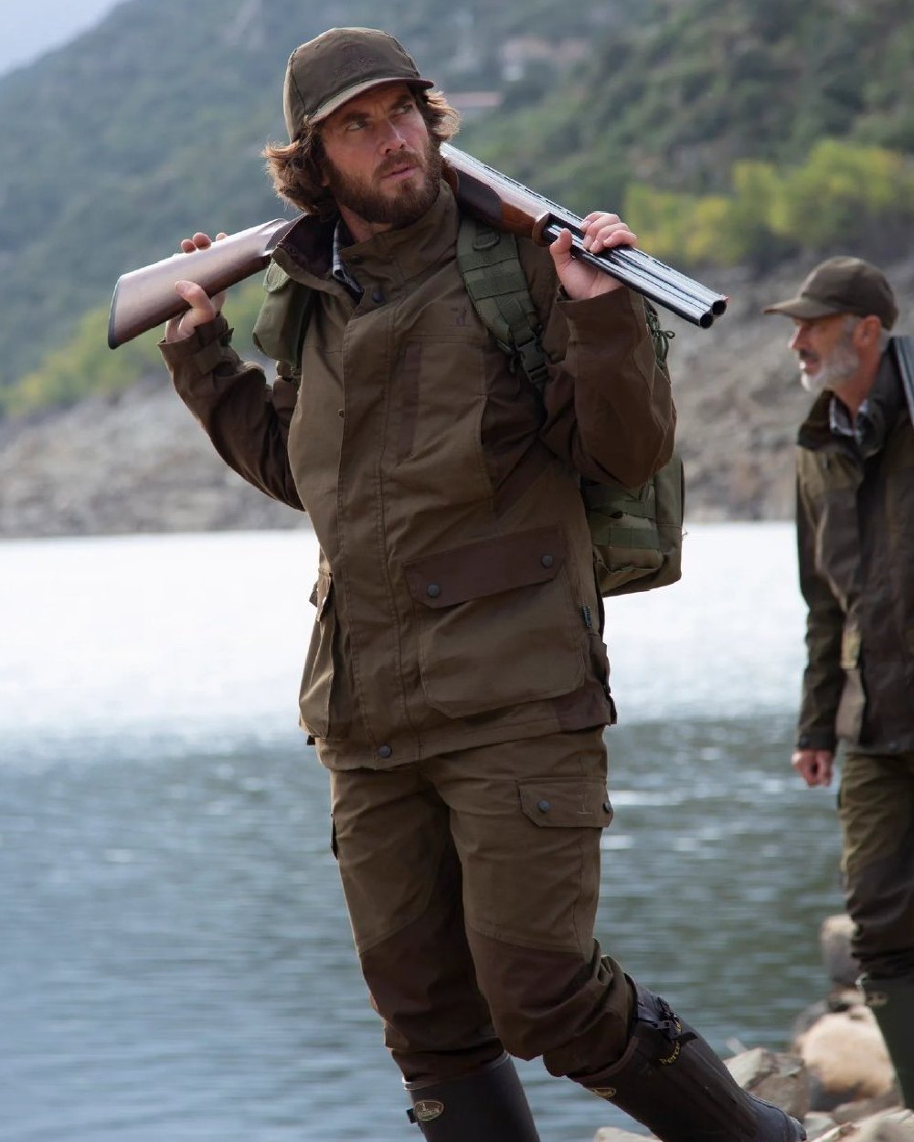 Khaki coloured Percussion Imperlight Reinforced Trousers on coastal background 