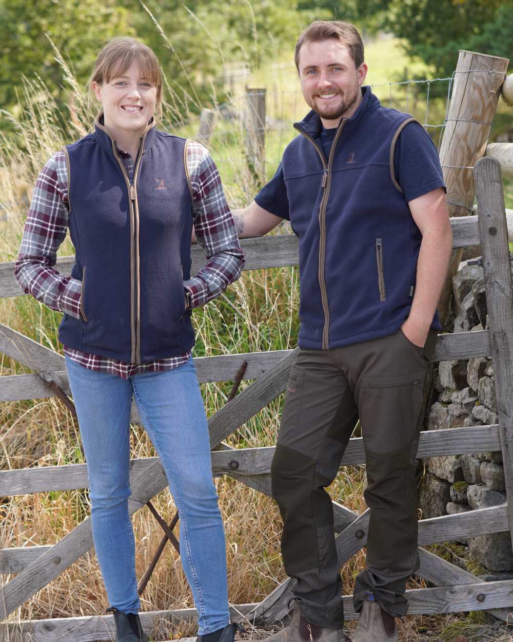 Navy coloured Percussion Ladies Scotland Fleece Gilet on farm background 