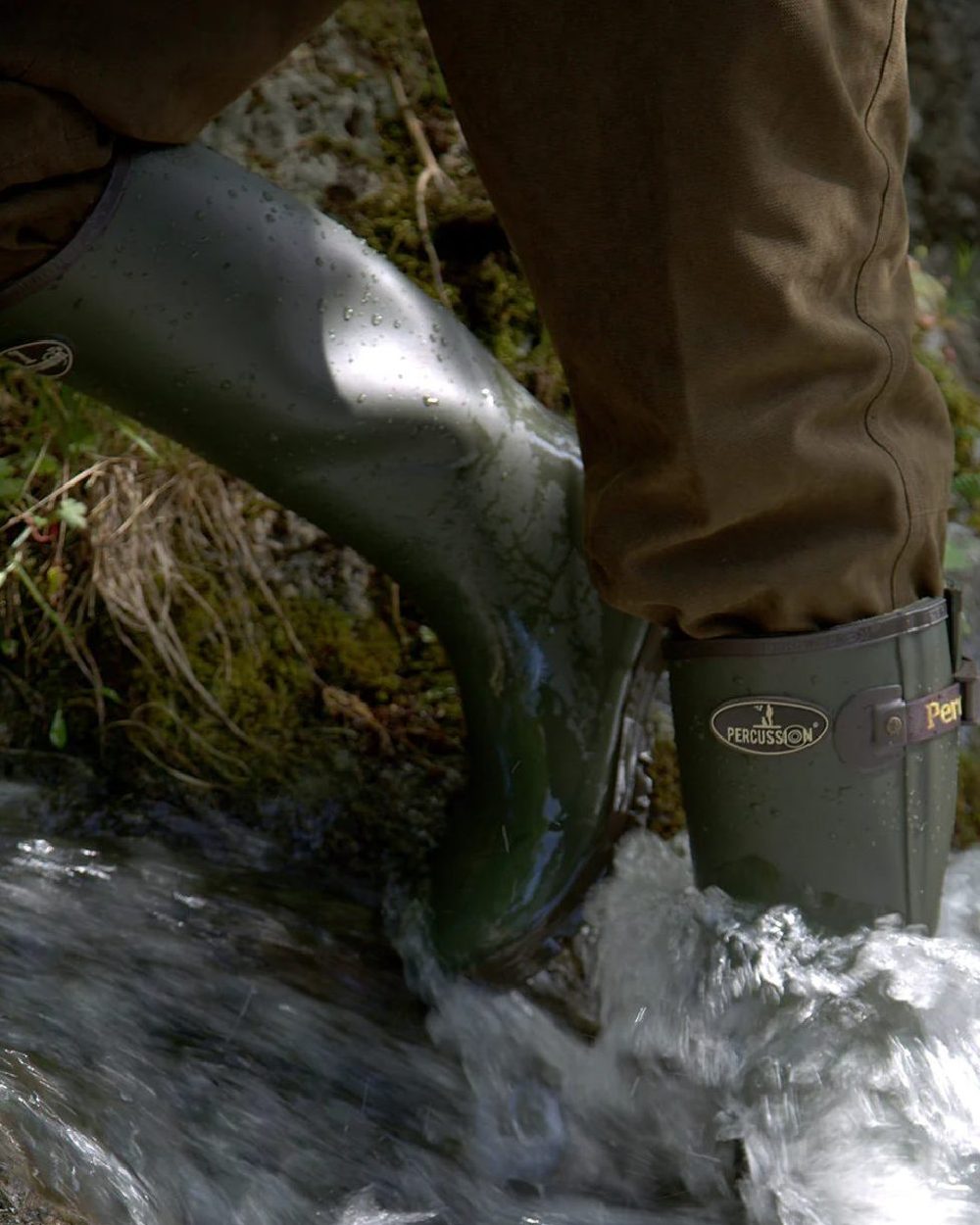 Khaki coloured Percussion Sologne Neoprene Wellington Boots on marshland background 