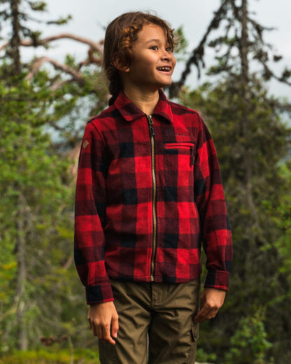 Red Black coloured Pinewood Childrens Canada Fleece Shirt on forest background 