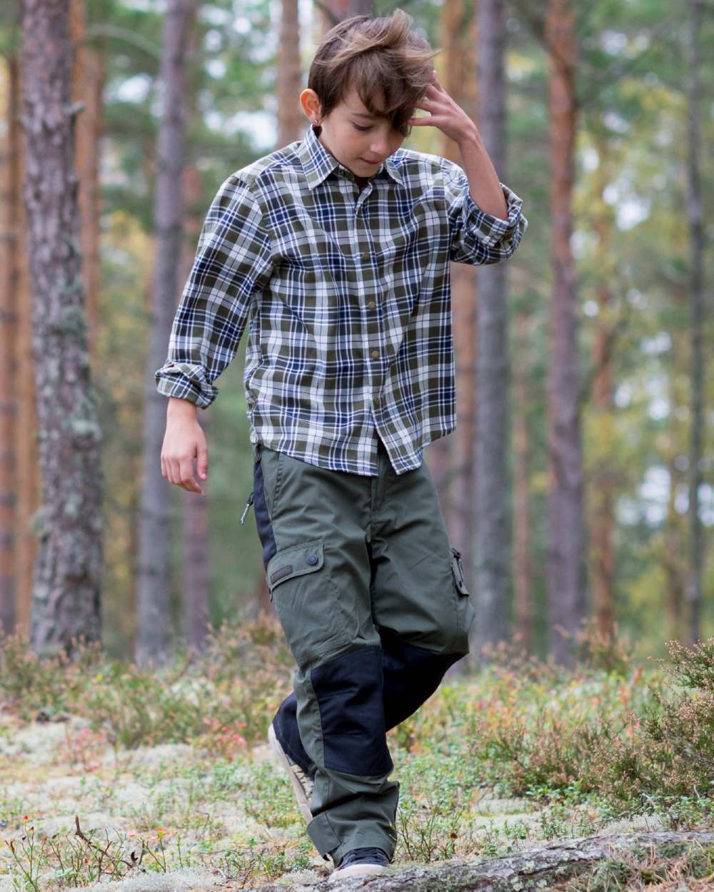 Mid Green Black coloured Pinewood Childrens Lappland Trousers on forest background 