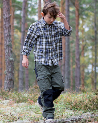 Mid Green Black coloured Pinewood Childrens Lappland Trousers on forest background 