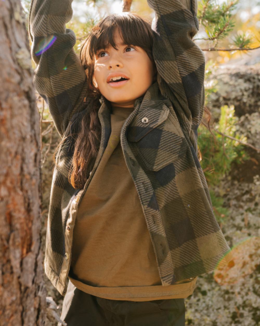 Hunter Olive coloured Pinewood Childrens Outdoor Life T-Shirt on forest background 