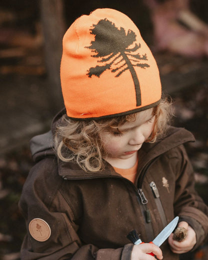 Orange Green coloured Pinewood Childrens Tree Hat on forest background 