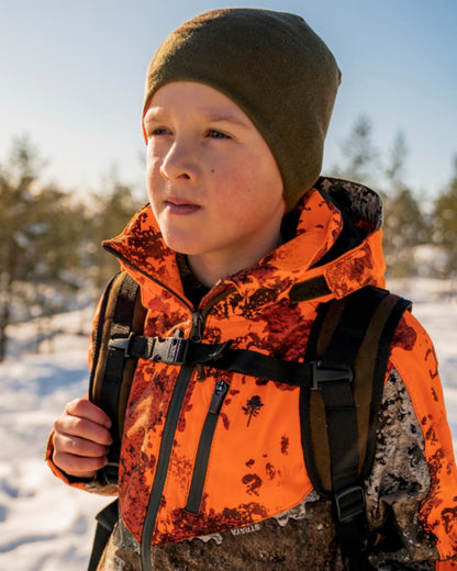 Orange Green coloured Pinewood Childrens Tree Hat on snow background 