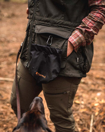 Black Coloured Pinewood Dog Sports Treat Bag on outdoor background 