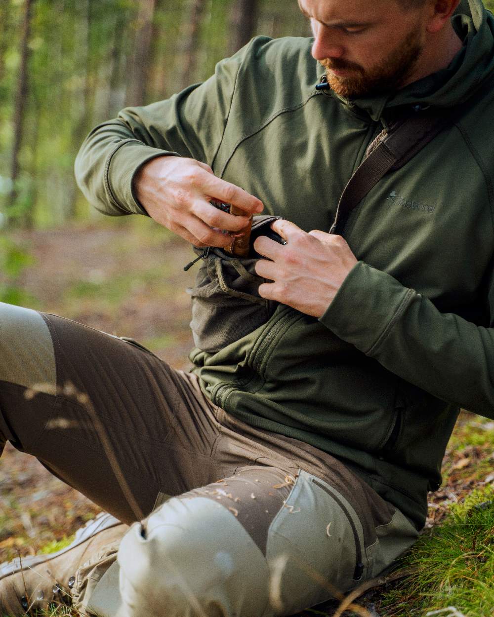 Moss Green Coloured Pinewood Finnveden Hoodie on outdoor background 