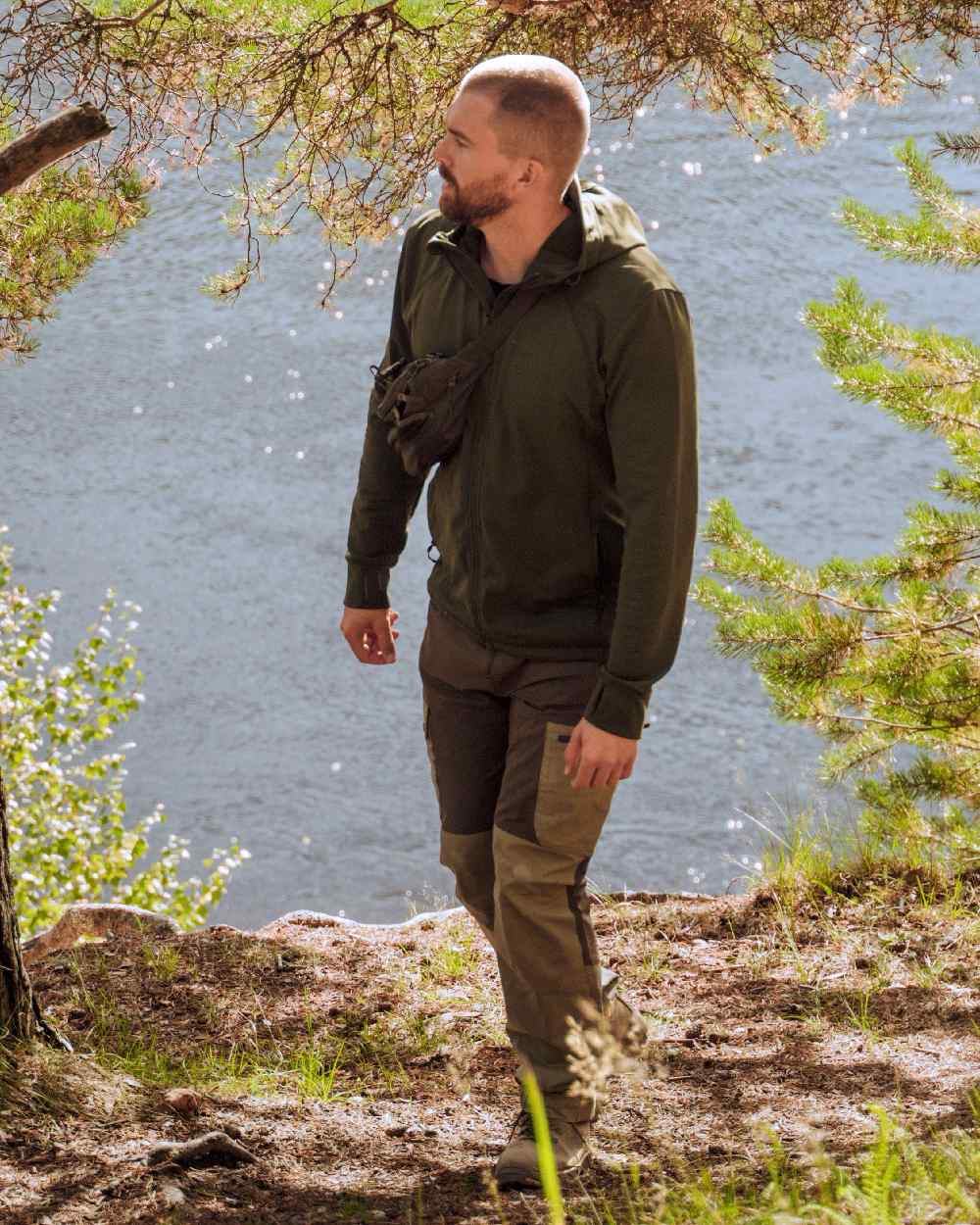Moss Green Coloured Pinewood Finnveden Hoodie on outdoor background 