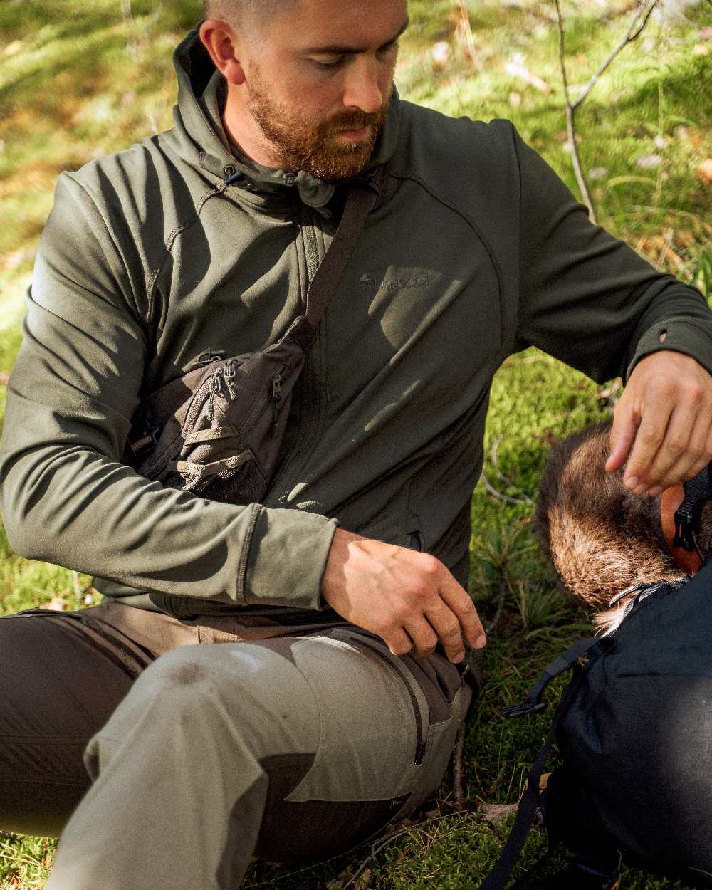 Moss Green Coloured Pinewood Finnveden Hoodie on outdoor background 